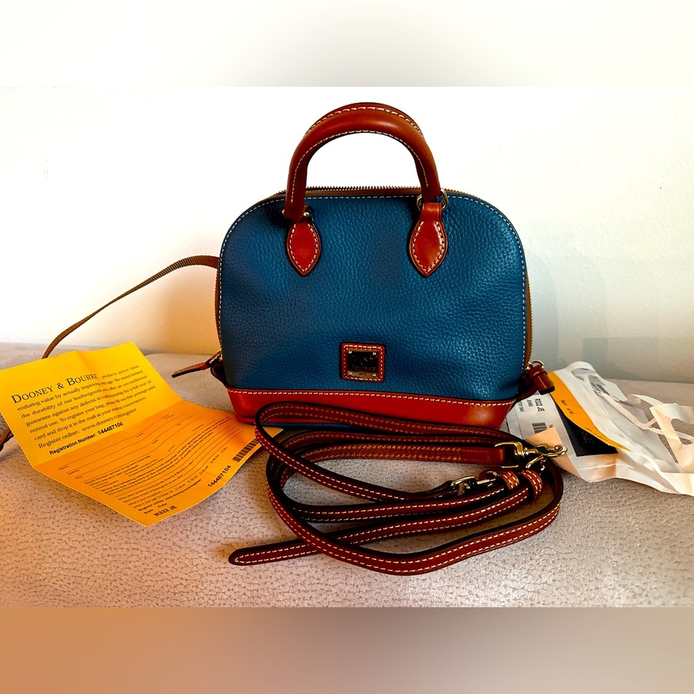 Denim color and brown Dooney & Burke pocket book. Really really nice.